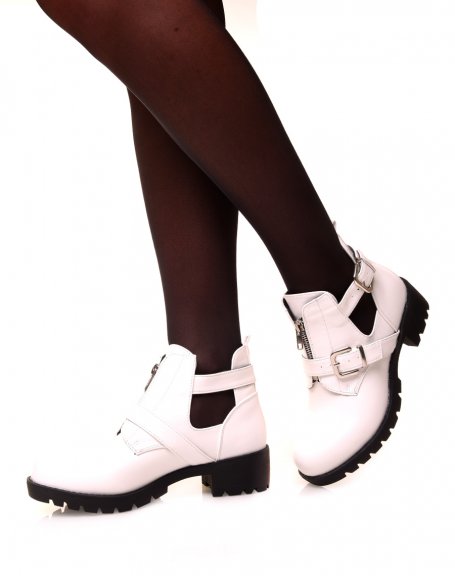 White ankle boots with straps and a zip