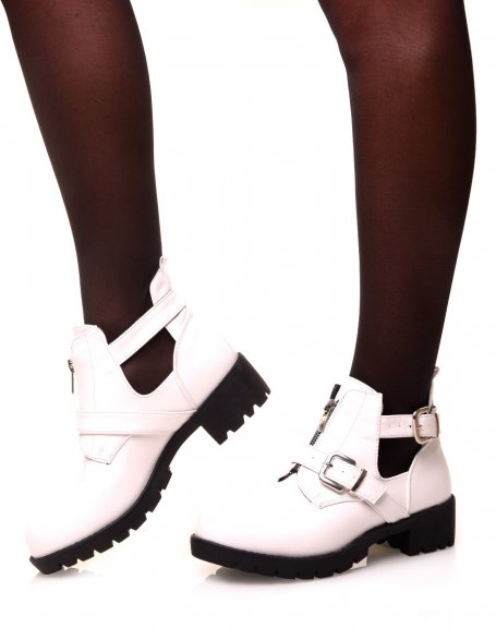 White ankle boots with straps and a zip