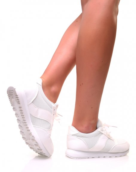 White canvas sneakers with laces and white sole