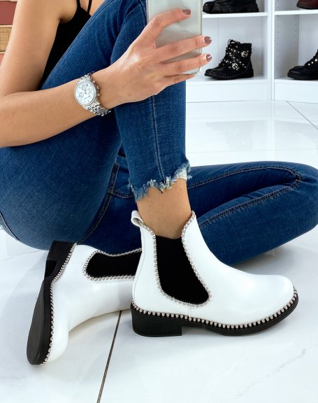 White Chelsea boots adorned with silver pearls