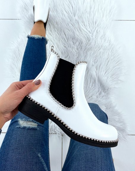 White Chelsea boots adorned with silver pearls