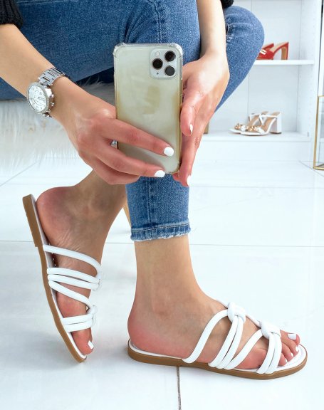 White flat mules with crossed straps