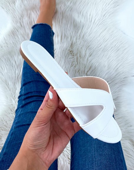 White flat mules with crossed straps