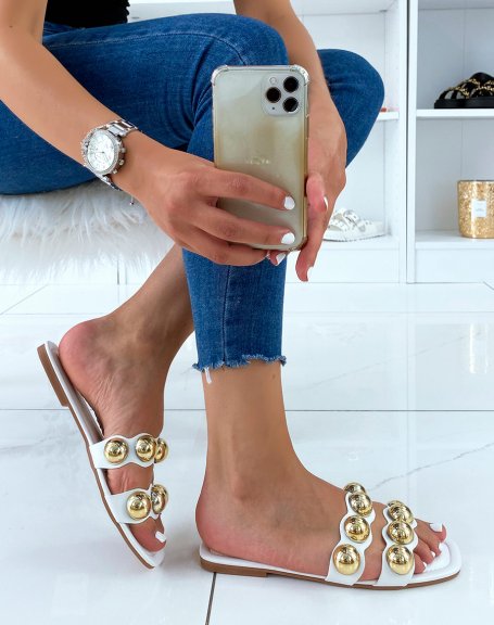 White flat mules with double straps and golden pearls