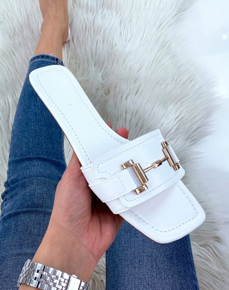 White flat mules with gold embellishment
