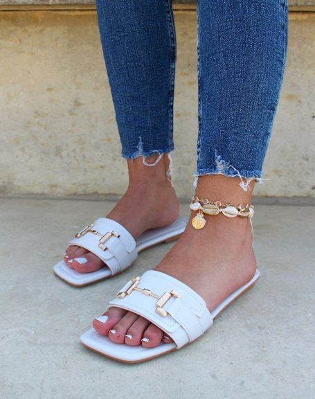 White flat mules with gold embellishment