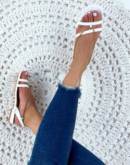 White flat sandals with chains