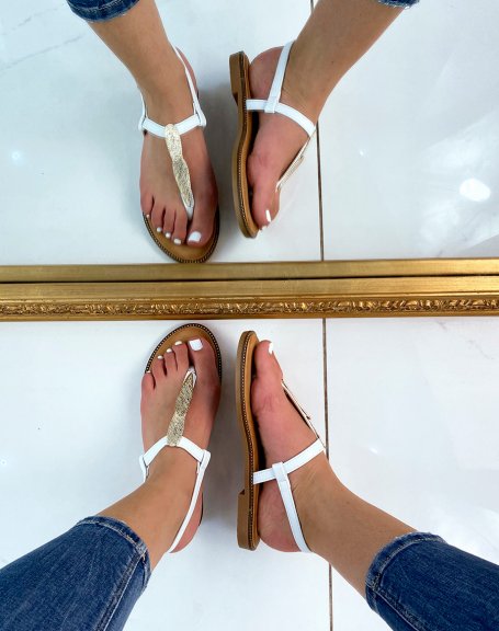 White flat sandals with gold detail