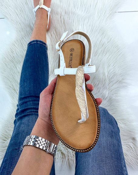 White flat sandals with gold detail