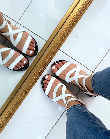 White flat sandals with multiple straps