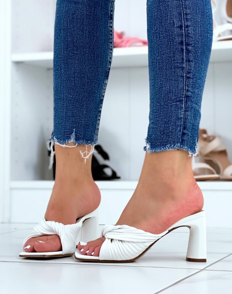 White heeled mules with a thick knotted strap