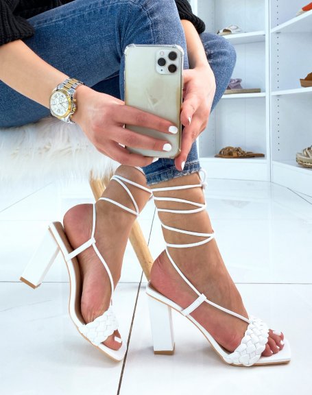 White heeled sandals with braided strap and long straps