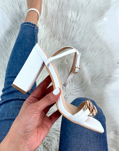 White heeled sandals with thin straps and gold chain