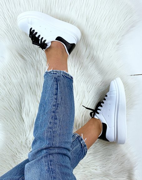 White high top sneakers with black glitter laces