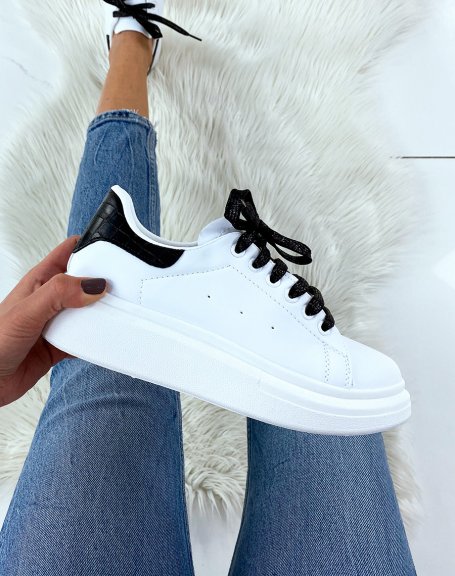 White high top sneakers with black glitter laces
