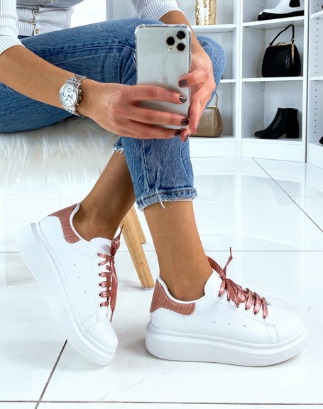 White high top sneakers with pink glitter laces