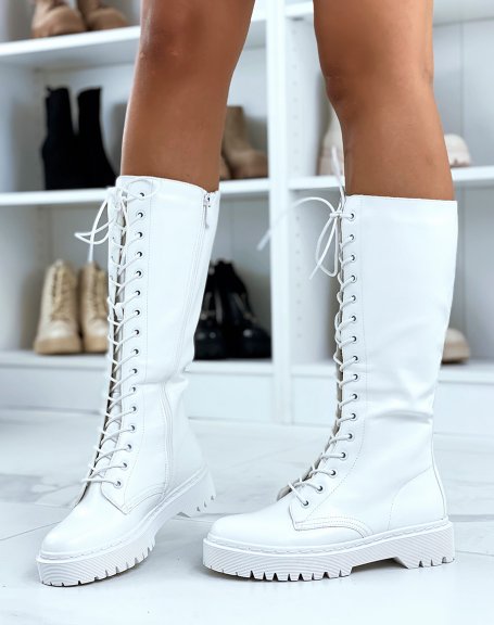 White lace-up boots with flat lug sole