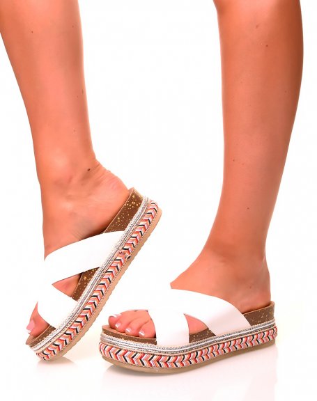 White mules with double crossed straps and braided soles