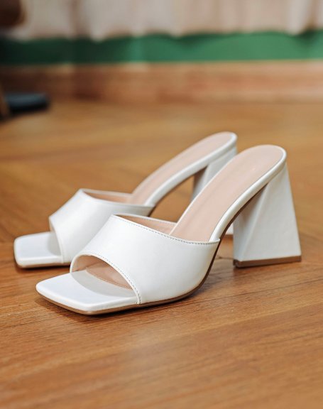 White mules with triangular heel