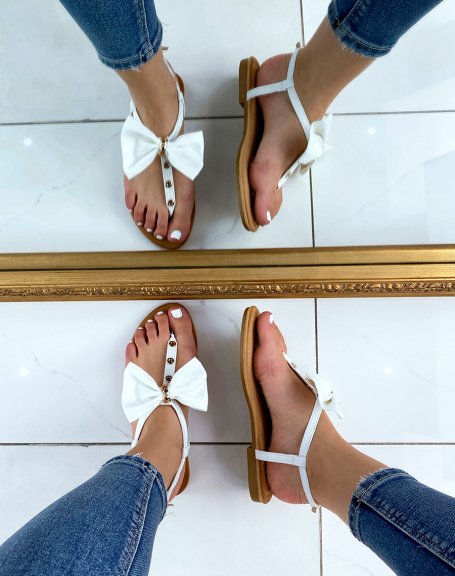 White sandals with bow and gold details