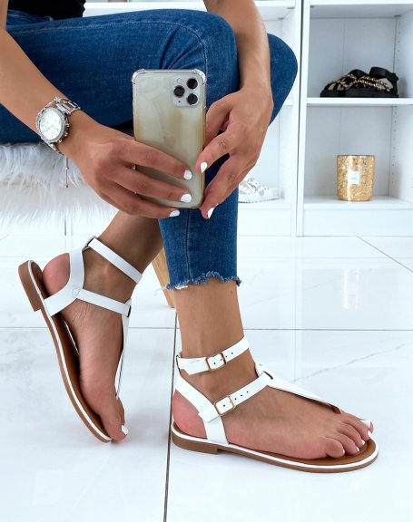 White sandals with double strap and golden buckles