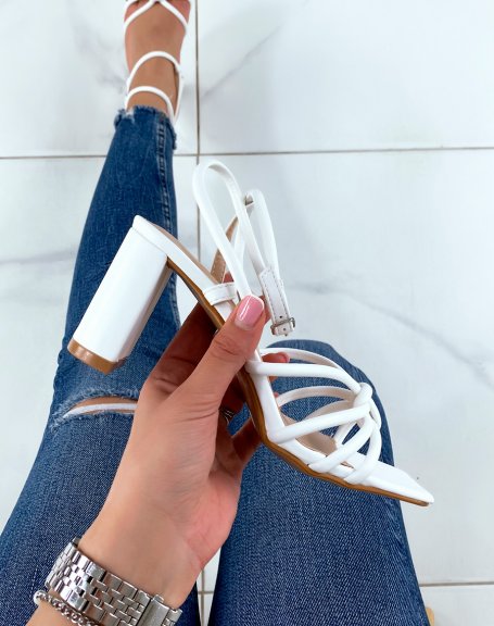 White sandals with high straps and tied heel
