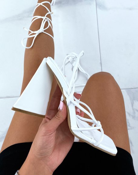 White sandals with laces and triangular heel