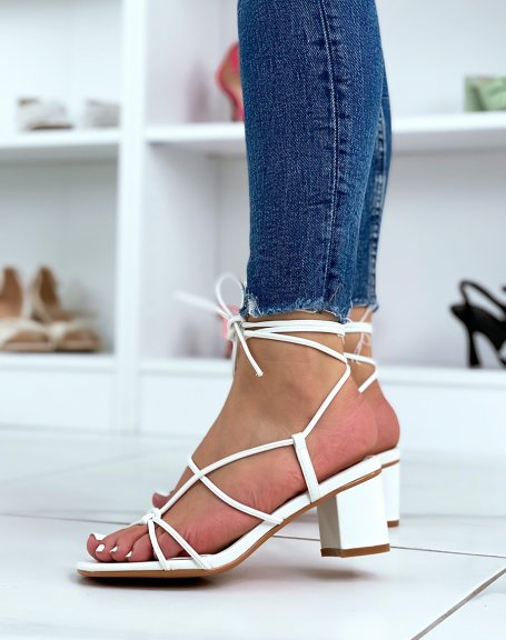 White sandals with small heel and multiple straps