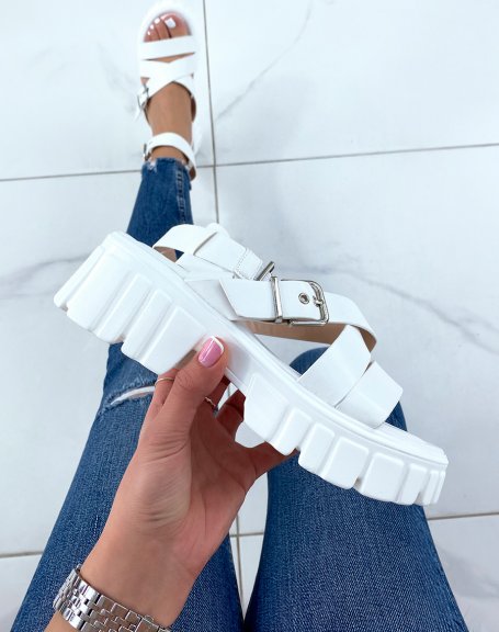 White sandals with thick straps and notched sole
