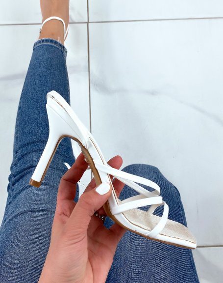 White sandals with thin strap and burlap interior and stiletto heel
