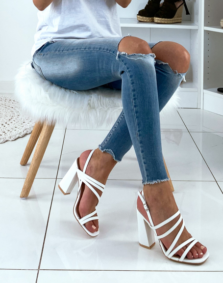 White sandals with thin straps and square heel