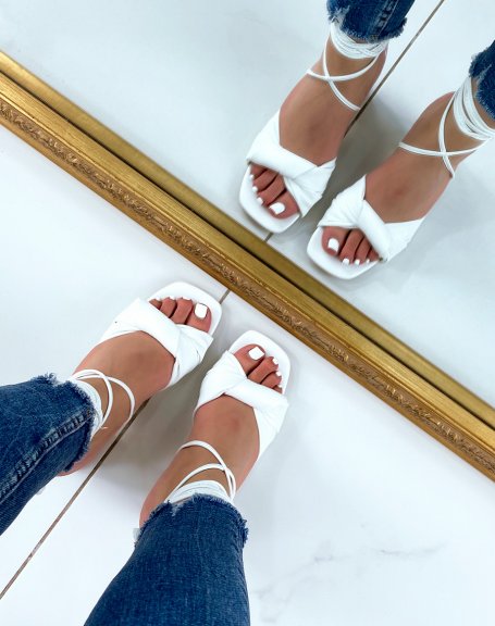 White sandals with tied strap and laces with low heel