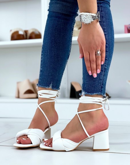 White sandals with tied strap and laces with low heel