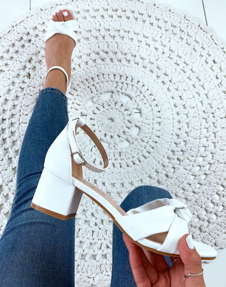 White sandals with tied straps