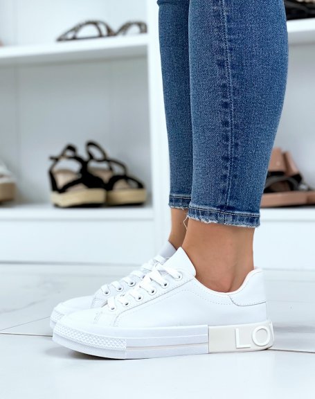 White sneakers with beige yoke on the back with LOVELY writing