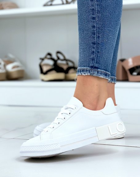 White sneakers with beige yoke on the back with LOVELY writing