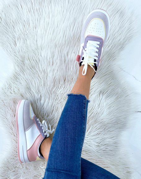 White sneakers with black, gray, pink, purple and pastel yellow panels