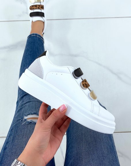 White sneakers with black, leopard and gold scratch