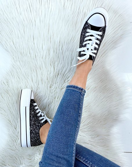 White sneakers with black sequins and studded detail