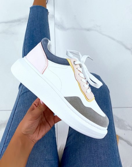 White sneakers with gray, pink, yellow and blue panels