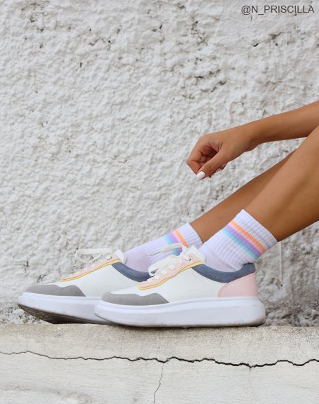 White sneakers with gray, pink, yellow and blue panels