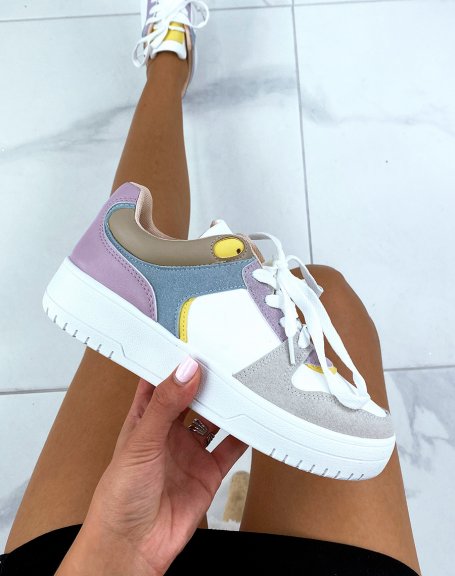 White sneakers with pink, yellow, purple, blue and gray panels