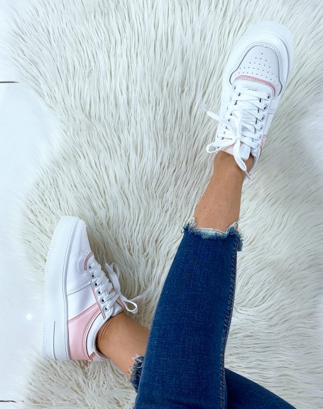 White sneakers with pink yoke
