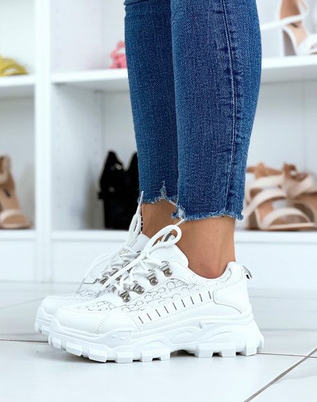 White sneakers with silver detail and notched sole