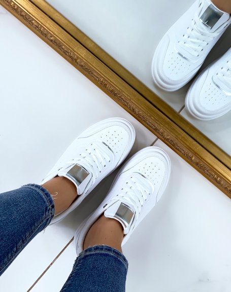 White sneakers with silver edging and thick sole
