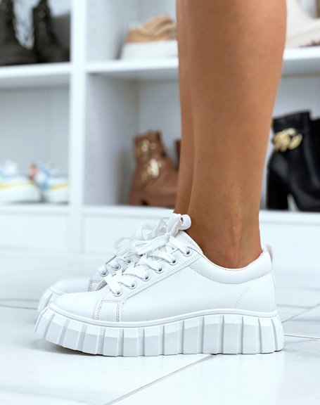 White sneakers with thick notched platform
