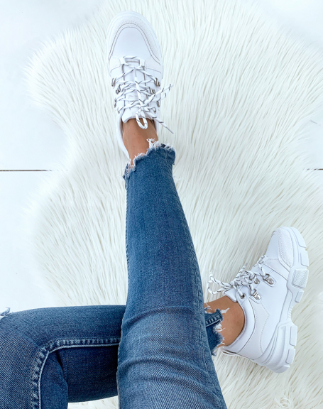 White sneakers with wedge soles and fancy laces