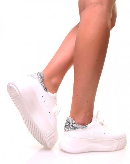 White sneakers with wedge soles and python inserts