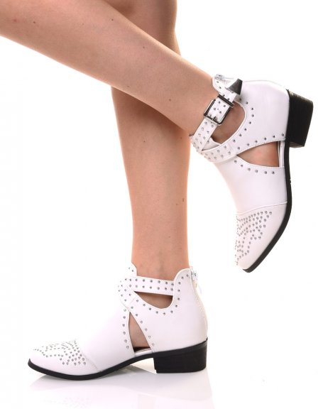 White studded ankle boots with crossed buckles