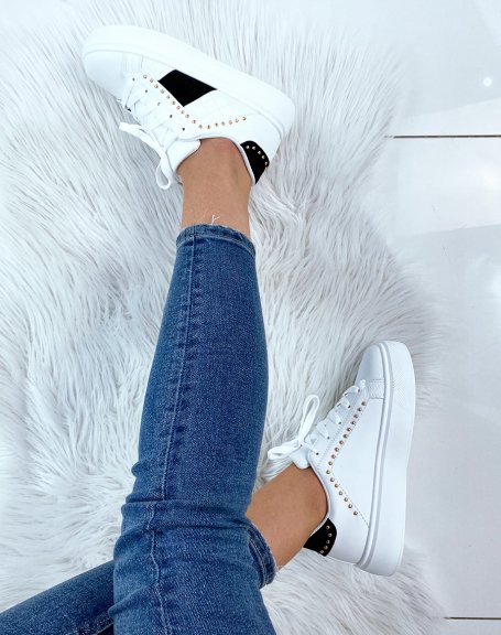 White studded sneaker with black inserts